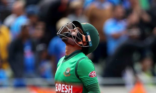Bangladesh's Mushfiqur Rahim reacts as he leaves the field after being dismissed by India's Yuzvendra Chahal. (Photo / AP)