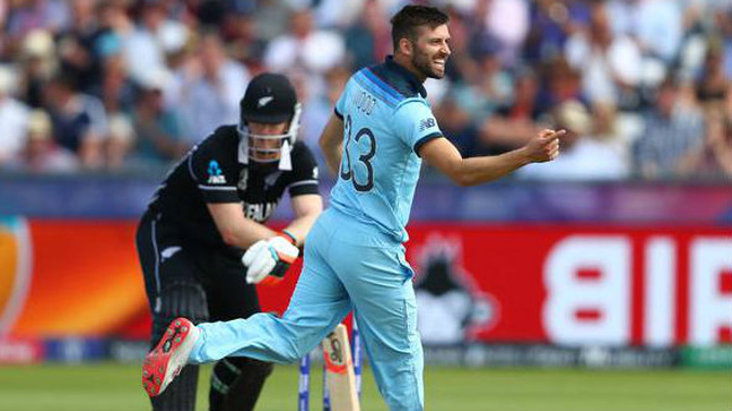 Mark Wood of England celebrates bowling Jimmy Neesham of New Zealand. (Photo / Getty)