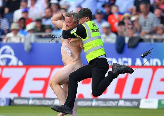 A streaker is tackled by a security guard at the Cricket World Cup match between the Black Caps and England. Photo / Getty
