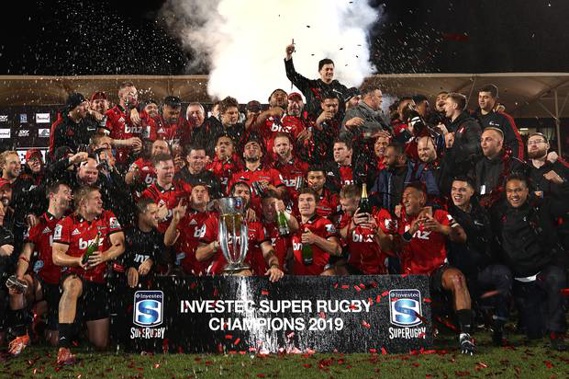 The Crusaders celebrate with the Super Rugby trophy. (Photo / Getty)
