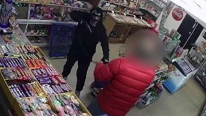 Police are hunting the masked robber. (Photo / Police)
