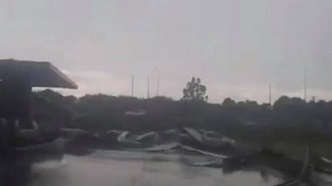 A tornado ripped roofing iron from a building in Taranaki this afternoon. Photo / Facebook