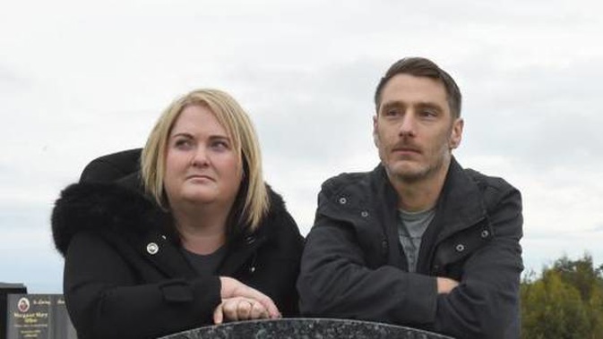 Joanna and Philip Bishop-Cherry want thieves to return a sculpture to the top of her father's gravestone. (Photo / Supplied)