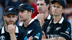New Zealand's Trent Boult, right, crosses his arms as he waits for the trophy presentation after losing the Cricket World Cup final match between England and New Zealand. Photo / AP