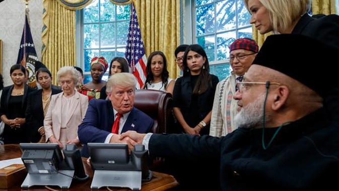 President Donald Trump shakes hands with Farid Ahmed in the Oval Office. (Photo / AP)