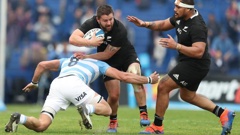 New Zealand's All Blacks Dane Coles, center, is tackled by Argentina's Los Pumas Javier Ortega Desio during a rugby championship match in Buenos Aires. (Photo / AP)