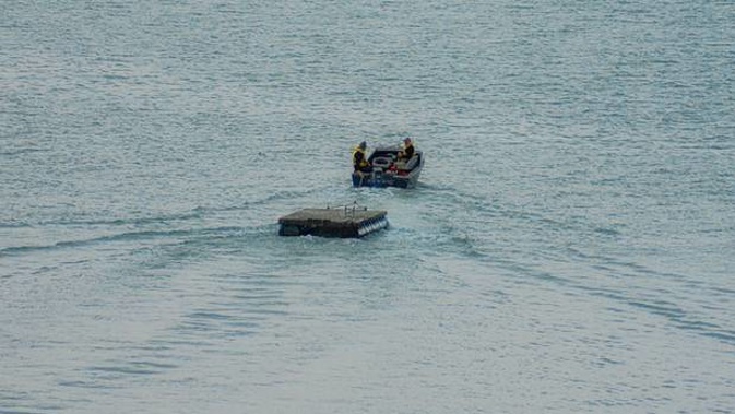 Police have posted this image of a pontoon being stolen on Waiheke Island in June. (Photo / NZ Police Facebook)