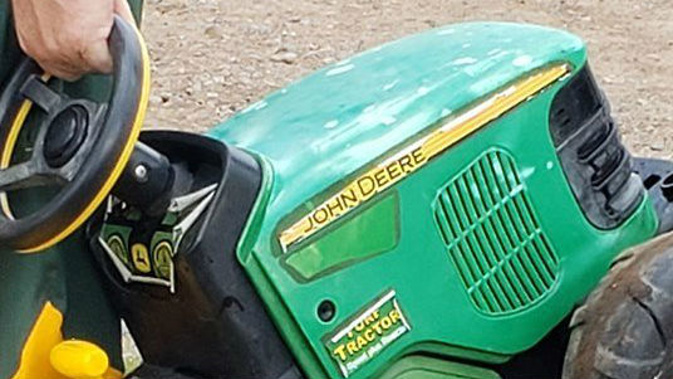 The toy tractor that the two-year-old escaped on. (Photo / CNN)