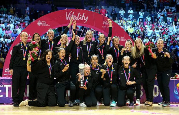 New Zealand's Laura Langman lifts the trophy with her team mates after winning the Netball World Cup. (Photo / Getty)