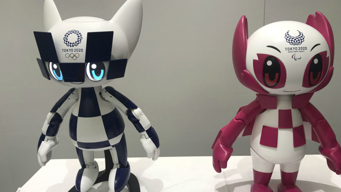 Robots of mascots of Olympics "Miraitowa," left, and Paralympics "Someity" are shown to the media at Toyota Motor Corp. (Photo / AP)