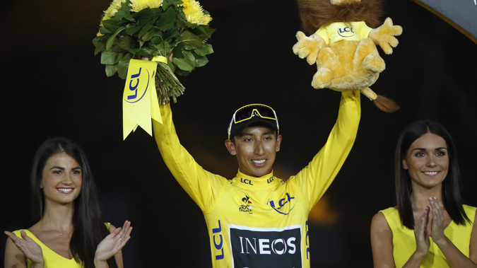 Colombia's Egan Bernal stands on the podium after winning the 2019 Tour de France. (Photo / AP)