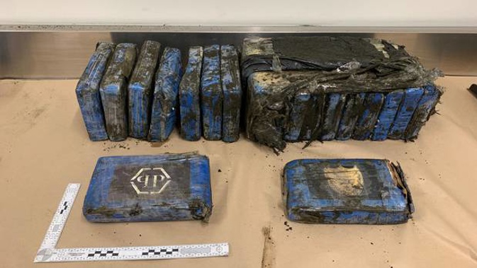 Police are investigating after $3 million of cocaine wrapped in plastic washed up on Bethells Beach. Photograph supplied by NZ Police