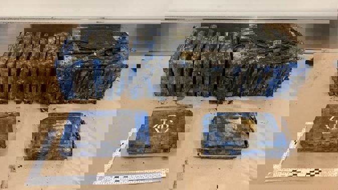 Police are investigating after $3 million of cocaine wrapped in plastic washed up on Bethells Beach. Photograph supplied by NZ Police
