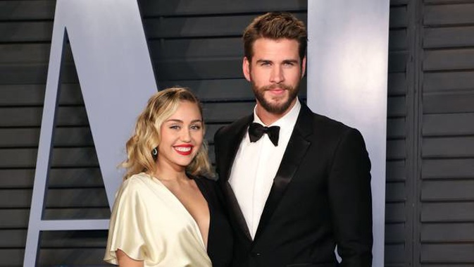 Miley Cyrus and Liam Hemsworth, seen here at the 2018 Vanity Fair Oscar Party, have announced their separation. (Photo / Getty)