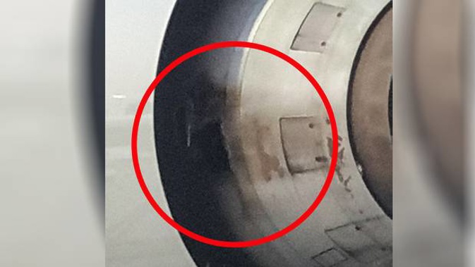 Passenger Andy Riley said there was a 40cm by 40cm hole in the side of the port side engine. (Photo / Andy Riley)