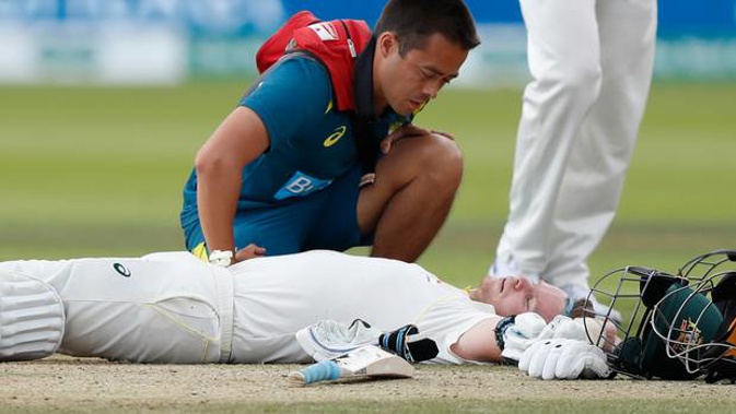 Australia's Steve Smith receives treatment as lies on the ground after being hit on the head by a ball bowled b England's Jofra Archer during play on day four of the 2nd Ashes Test. (Photo / AP)