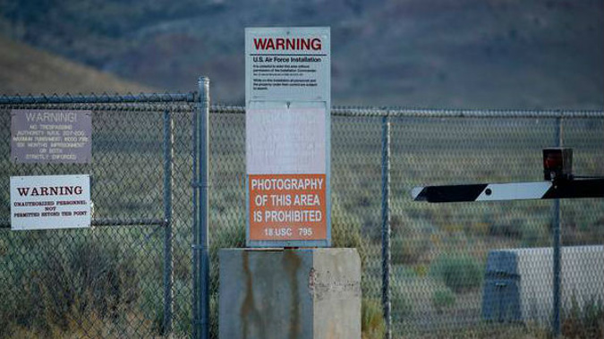 Signs warn about trespassing at an entrance to the Nevada Test and Training Range near Area 51 outside of Rachel, Nevada. (Photo / AP)