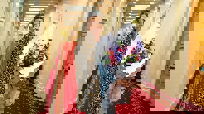 National Party deputy leader Paula Bennett with a larger bunch of flowers than those she sent to Winston Peters. (Photo / Mark Mitchell)