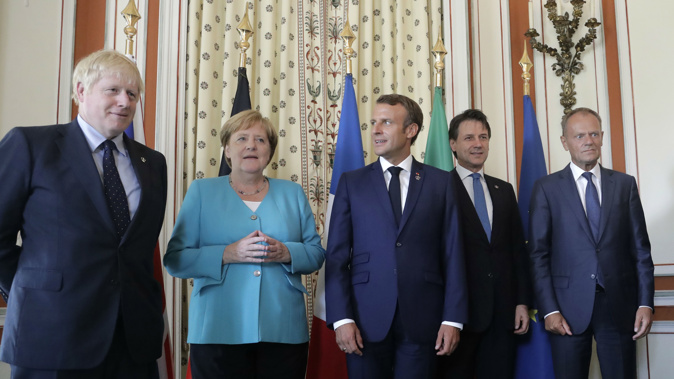 Boris Johnson, Angela Merkel, Emmanuel Macron, Giuseppe Conte and Donald Tusk pose for a photo at the summit. (Photo / AP)