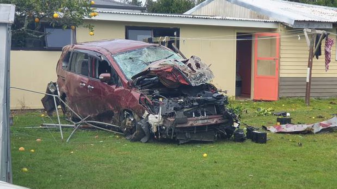 The car crashed off the Southern Motorway, down a bank and into a house in Otara. (Photo / Supplied)