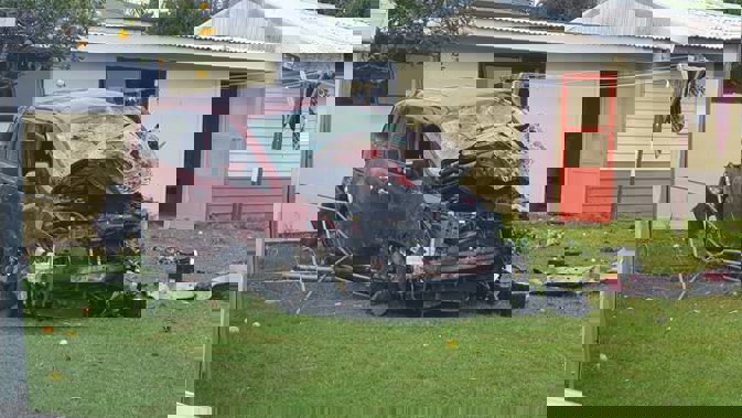 The car crashed off the Southern Motorway, down a bank and into a house in Otara. (Photo / Supplied)