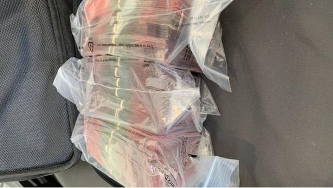 Police located a total of $250,000 in cash at the properties. (Photo / NZ Police)