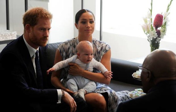 Prince Harry and Meghan, Duchess of Sussex, holding their son Archie, on their tour of Africa. Photo / AP