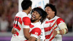 Japan's Kenki Fukuoka celebrates with teammates after scoring against Scotland. Photo / AP
