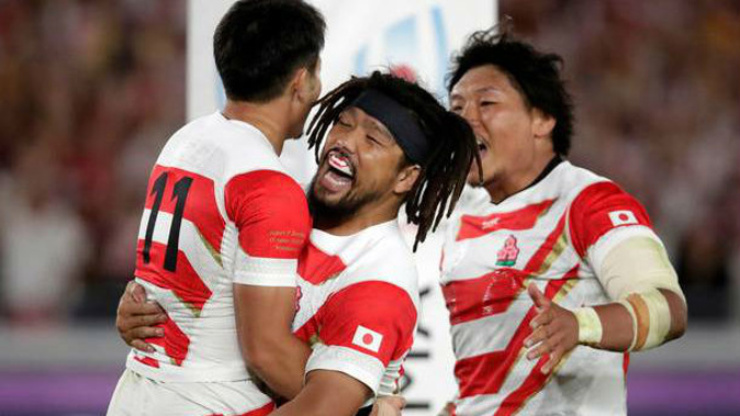 Japan's Kenki Fukuoka celebrates with teammates after scoring against Scotland. Photo / AP