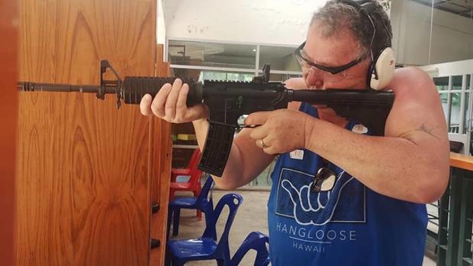 Experts say it appears Jones is holding an AR-15 that is banned in New Zealand. (Photo / Facebook)