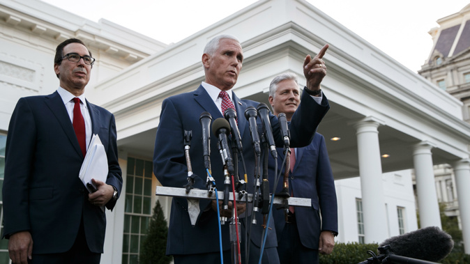 Steven Mnuchin, Mike Pence and Robert O'Brien make the sanction announcement. (Photo / AP)