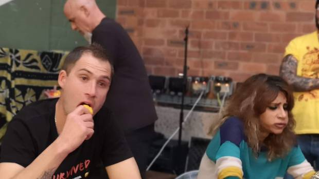 Justin Rummel competes against World Chilli Eating Championship winner Shahina Waseem in the UK last week. Photo / Supplied