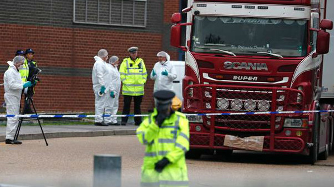 Police forensic officers examine the truck containing the 39 dead bodies. (Photo / AP)
