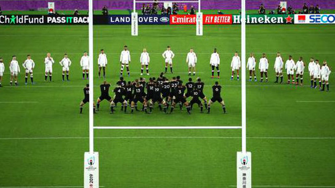 England players formed a V as the All Blacks did the haka. (Photo / Getty)