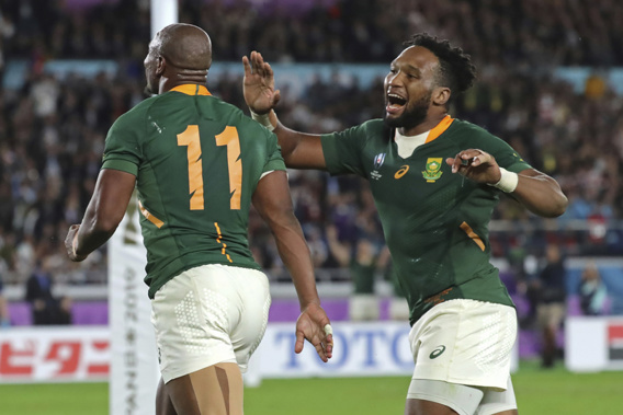 South Africa's Makazole Mapimpi, celebrates with teammate Lukhanyo Am after scoring a try: Photo / AP