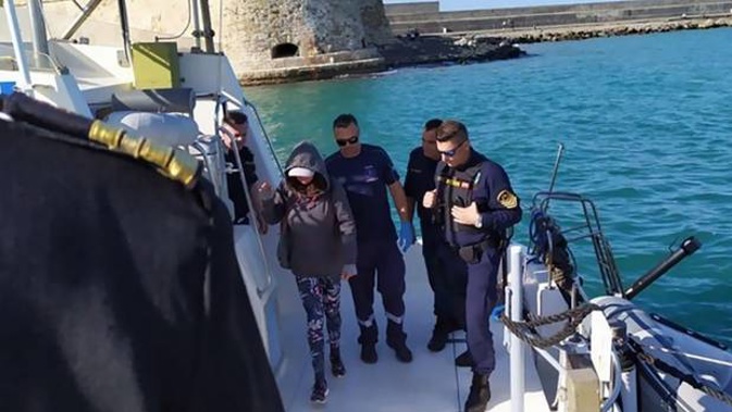 The Greek coastguard help a New Zealand woman ashore in Crete after she was found afloat in a dinghy in the Aegean sea on Sunday morning. Photo / Crete Live
