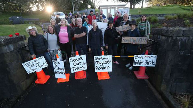 30 people have gathered to block the entrance to Mt Albert in an effort to save trees. (Photo / Jason Oxenham)