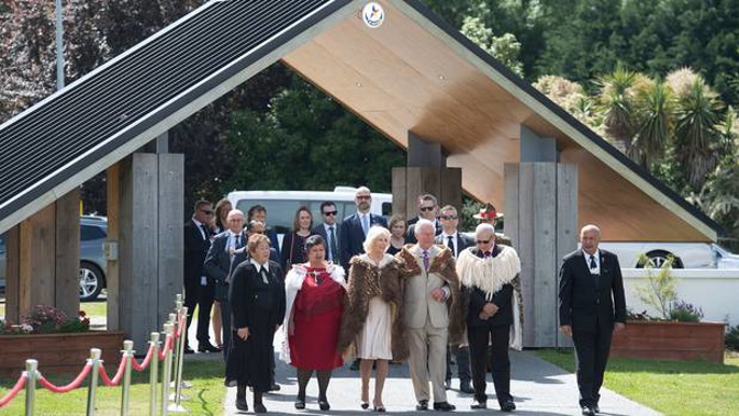 Prince Charles, centre right, and Camilla, centre left, stand with Maori elders during a powhiri at Tuahiwi Marae in Christchurch. Photo / Supplied
