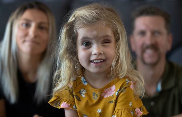 Annabelle, 3, and her parents Maria and Alex Geisler.