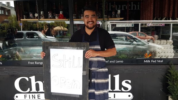 Joey Johnson at Churchills butchery in Kerikeri, where staff are preparing for a rush on anything that can be barbecued. Photo / Peter de Graaf