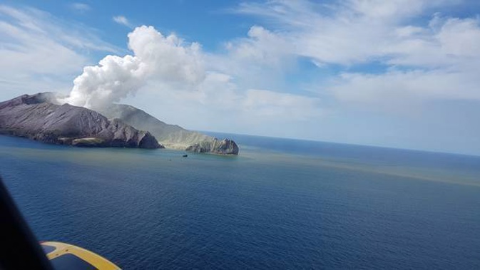 Steam, volcanic ash, toxic gases and sediment streams from the site of the eruption at Whakaari / White Island. Photo / Auckland Rescue Helicopter Trust