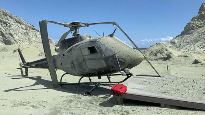 A helicopter damaged after the White Island eruption. (Photo / Instagram)