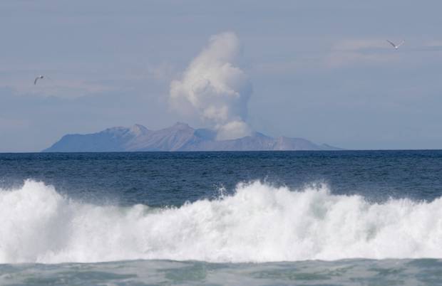 Plumes of steam rise above White Island off the coast of Whakatane. Photo / AP