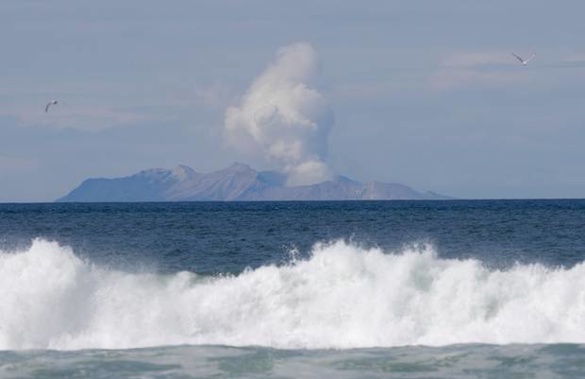 Plumes of steam rise above White Island off the coast of Whakatane. Photo / AP