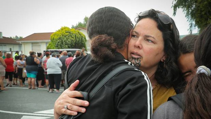 Phillippa Watson, a teacher at Flaxmere Primary School, comforts students after the lockdown. Photo / Warren Buckland