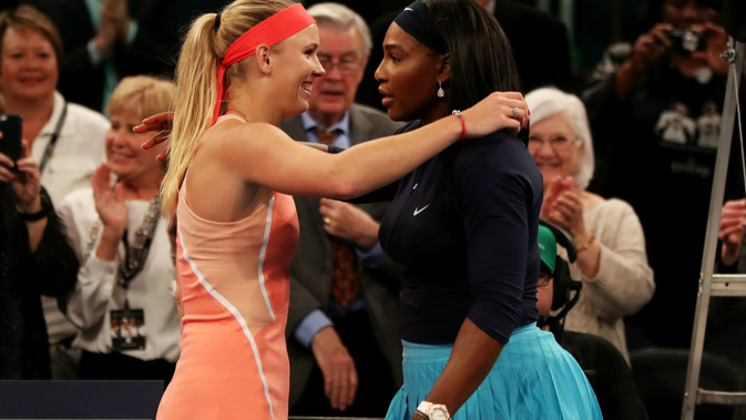 Caroline Wozniacki and Serena Williams embrace after facing each other in 2016. (Photo / Getty)