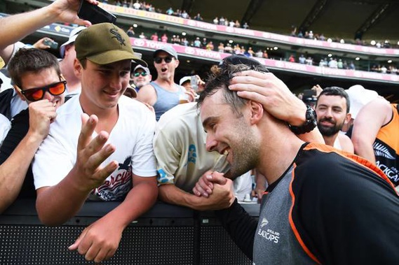 Tom Blundell is congratulated by the fans after his century at the MCG. Photo / Photosport