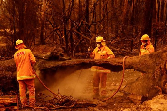 Fire crews put out spot fires in Sarsfield in Victora. So far there are 53 fires burning across Victoria. Photo / Getty