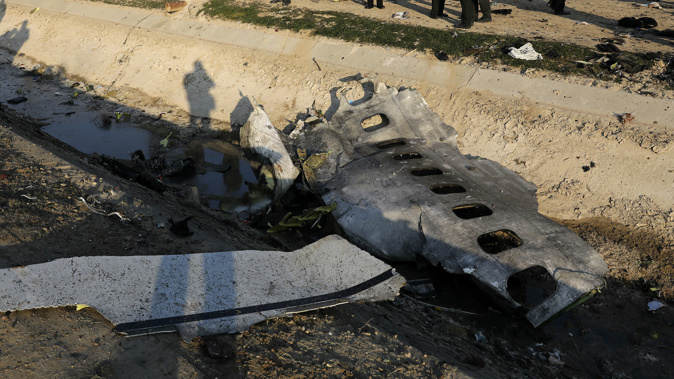 Debris is seen from an Ukrainian plane which crashed as authorities work at the scene in Shahedshahr, southwest of the capital Tehran, Iran. (Photo / AP)