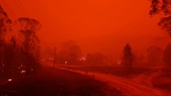 Fire and thick smoke in the village of Nerrigundah, Australia. Photo / AP